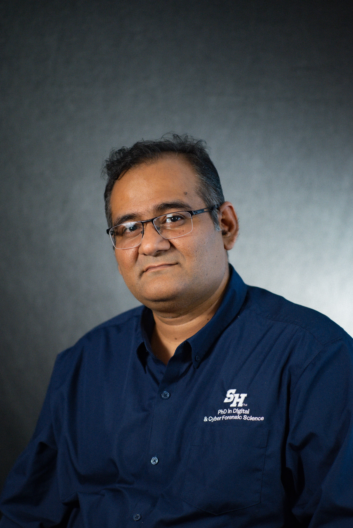 Madhab Chandra Das wearing a Sam Houston State University shirt